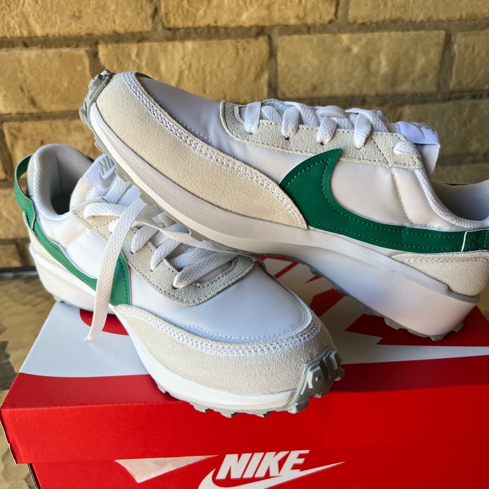 Green and white Nike sneakers
